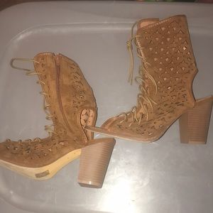 Brown heels with lace up front and peek a boo heel. Size 10